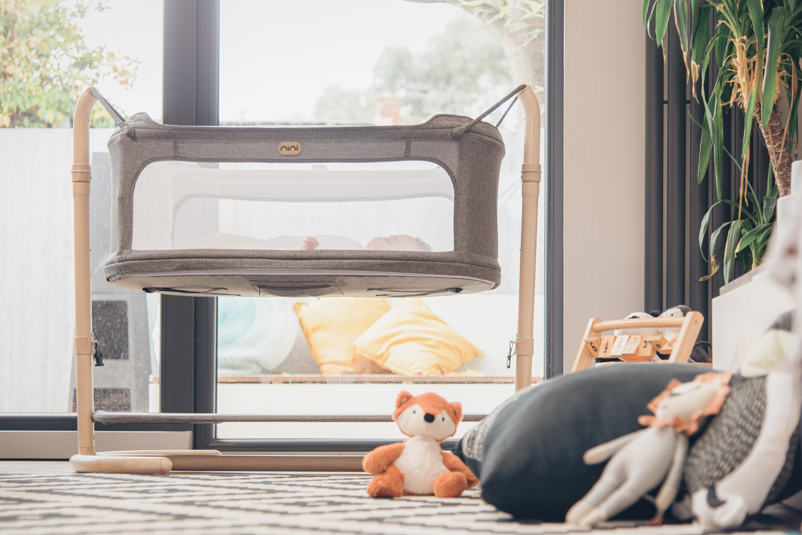 How a Swing Cot Can Help Your Baby Sleep Through the Night